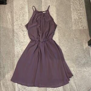 Women’s purple mini dress with cinched waist